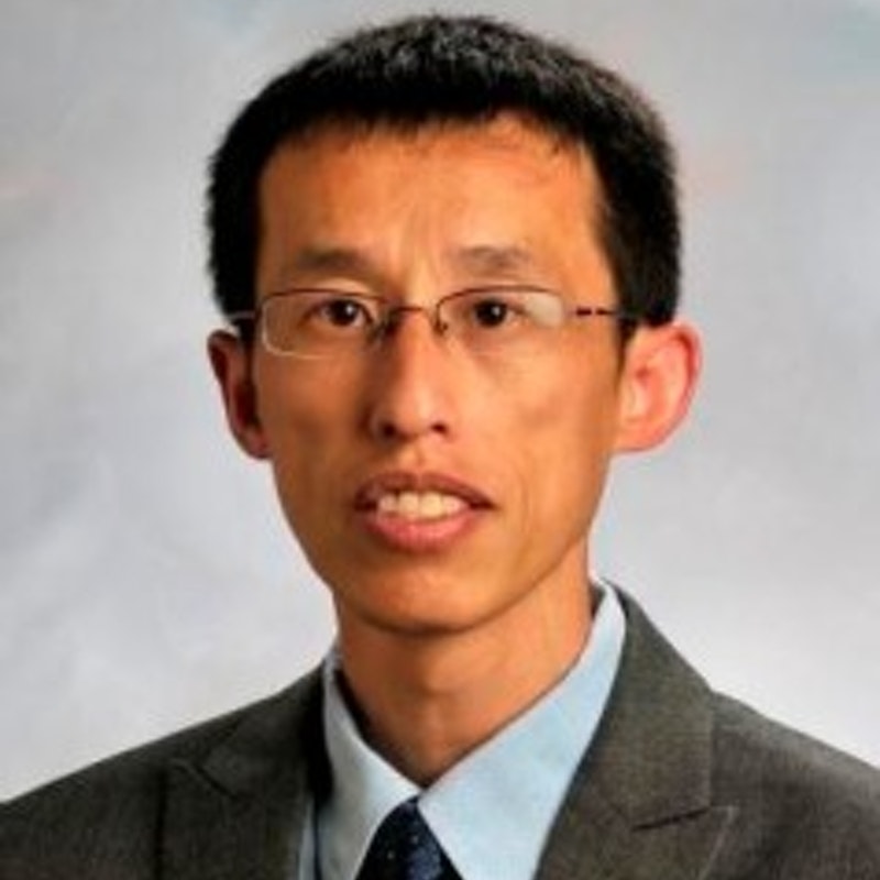 A professional UTK MPH faculty headshot of Jiangang Chen